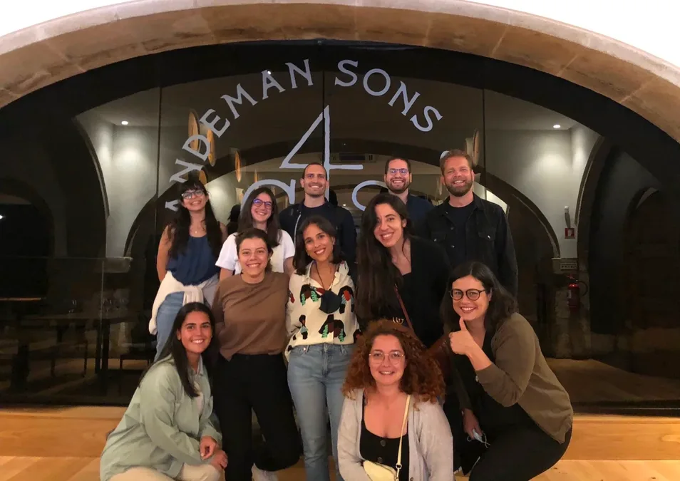The design team together in person at the end of an onsite week
