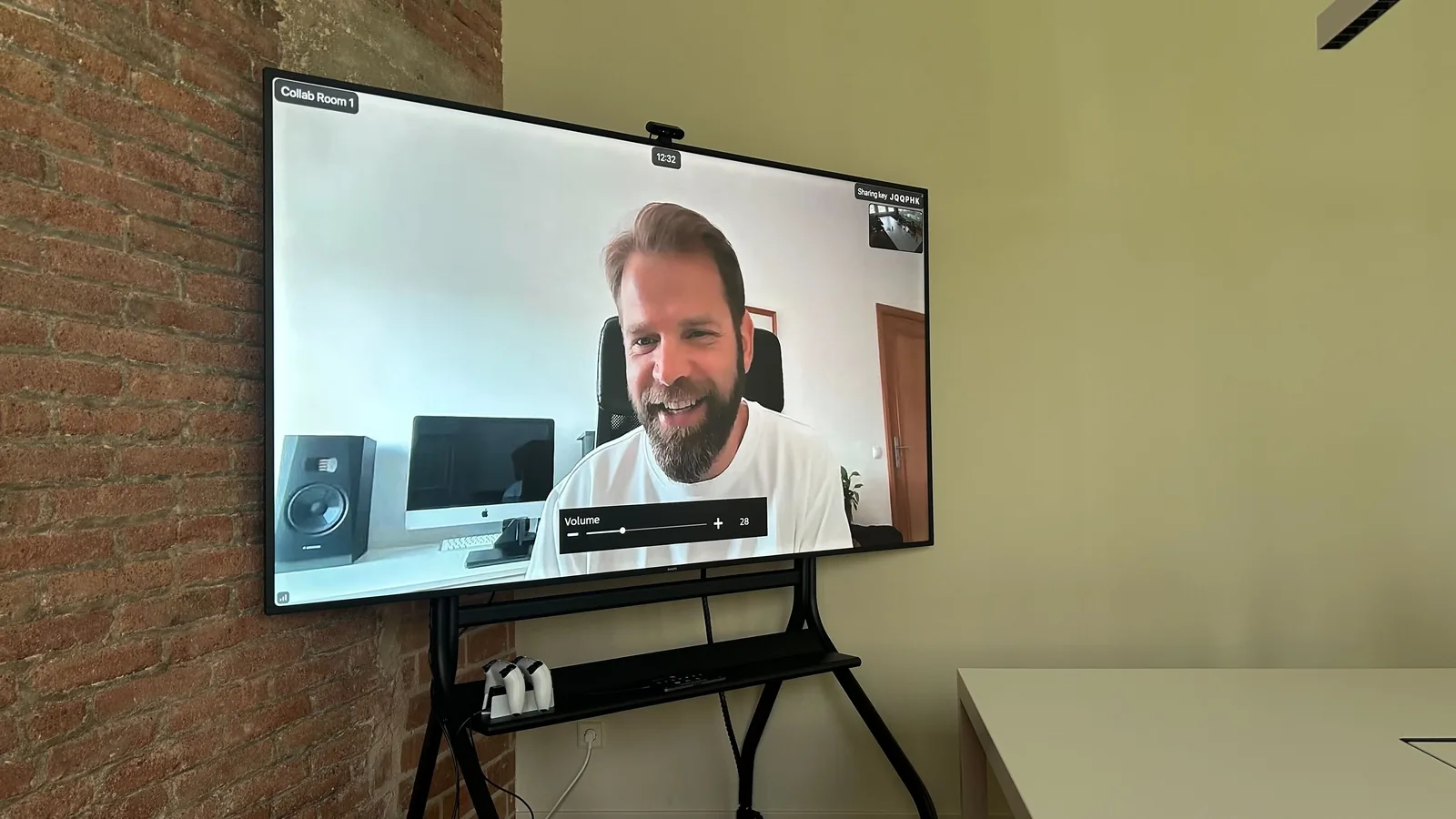 A design session running on a meeting-room screen, joined remotely across time zones